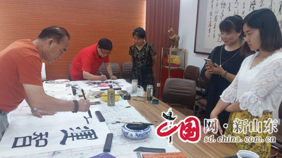 张店国土资源分局庆“七一”暨新《测绘法》实施一周年书画笔会举行